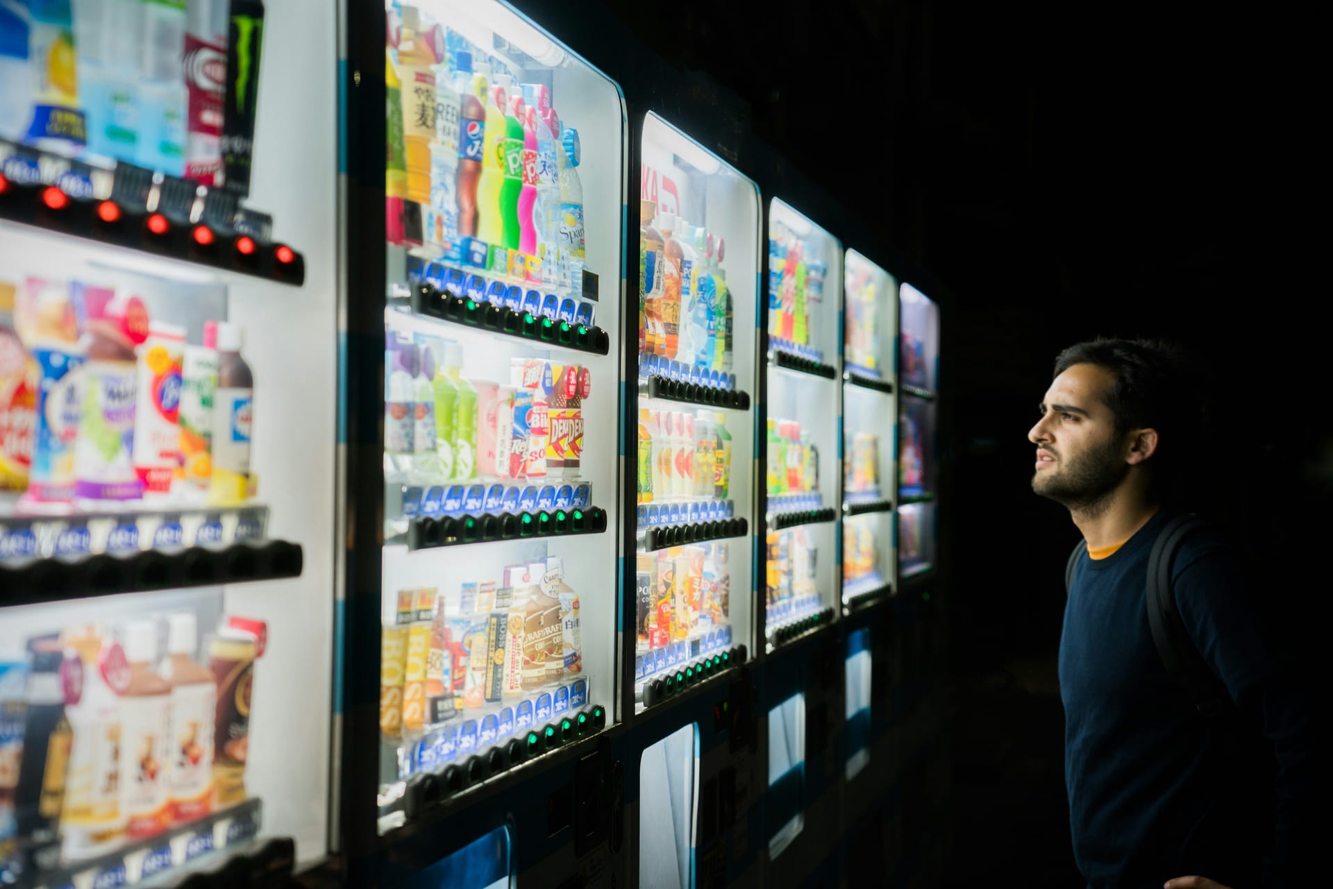 Customer choosing a product from a YOYO vending machine
